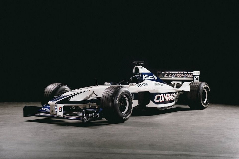 auto de formula1 compaq blanco negro y azul